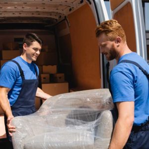 Two Men Moving Furniture